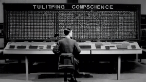 A black and white photograph of Alan Turing, the father of computer science, standing in front of a large computer with punched cards. The image should con